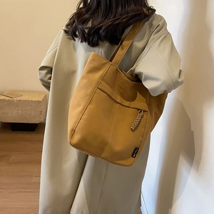 Bolso tote de lona amarillo jengibre de gran capacidad con colgante tejido para diario