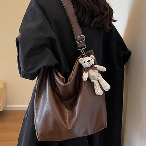 Brown large capacity hobo tote bag with adjustable strap and cute woven bear charm