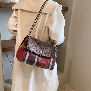 Women plaid tote bag with chain strap shown on model in a stylish beige coat