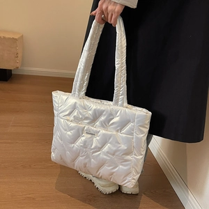Quilted white puffer tote bag with large capacity and thick handles for winter commuting