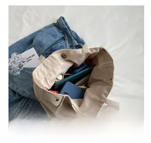 Internal compartment view of a canvas tote bag showing large capacity for daily essentials