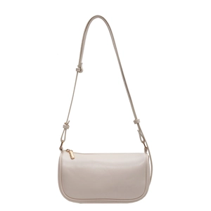 Minimalist beige crossbody pillow bag with adjustable strap and gold hardware