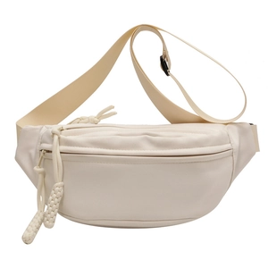 Minimalist beige canvas fanny pack featuring a main zipper and adjustable strap