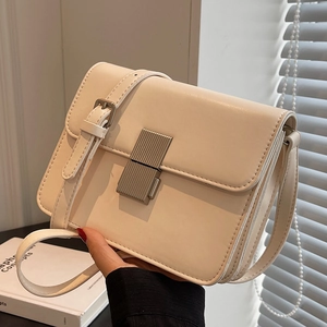 Elegant cream rectangular crossbody bag with silver vertical stripe metallic buckle