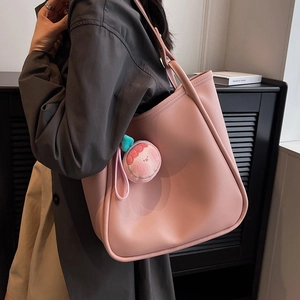 Pink PU leather tote bag with peach plush charm for women's casual shoulder wear