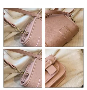 Detail shots of pink lychee leather crossbody bag with light gold metal buckles and stitching