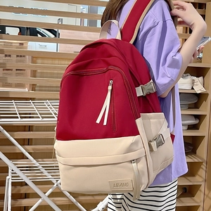 Sac à dos grande capacité bicolore rouge et beige pour étudiants avec compartiments multiples