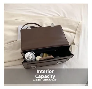 Macro view of dark brown vintage backpack interior showing large storage capacity