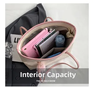 Detailed internal capacity of check-pattern tote bag showing tablet and umbrella storage