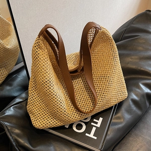 Summer woven straw shoulder bag with brown leather straps and hollow crochet pattern