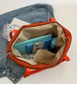 Quilted tote bag interior showing large capacity for tablets, phone and daily essentials