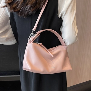 Chic light pink faux leather pillow bag with silver metal logo for women