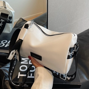 White lychee leather cylinder bag with wide fashion strap and metal zipper