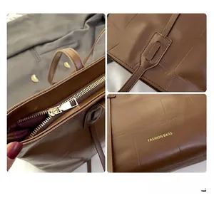 Detail of dark brown tote bag showing crocodile texture, gold zipper, and reinforced stitching