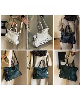 Detail view of tote bag rivets, leather textures, and tassels in white, black and green