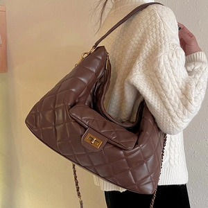 Deep brown quilted leather shoulder bag with gold twist lock for women in autumn