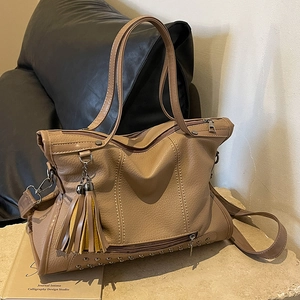Khaki retro tote bag with rivet details, fringe charms and adjustable shoulder strap