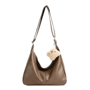 Brown large capacity leather hobo bag with adjustable strap and cute smiley pendant