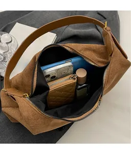 Internal view of large capacity matte tote showing phone, wallet and cosmetics storage
