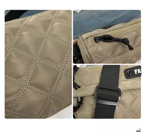 Detail view of khaki quilted crossbody bag with white stitching and nylon strap