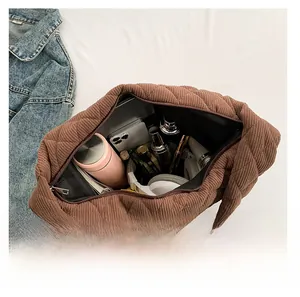 Interior view of brown quilted corduroy tote bag showing large capacity for essentials