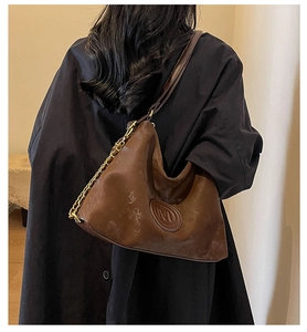 Brown vintage hobo bag with M-logo plaque and gold chain leather strap detail