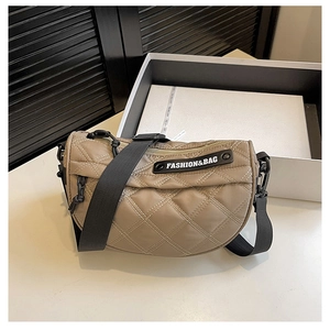 Detail of khaki quilted nylon crossbody bag with adjustable strap and fashion logo