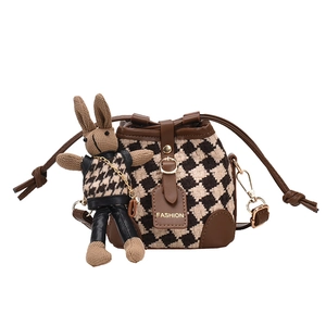 Mini brown plaid bucket bag with a cute rabbit charm and leather fashion tag