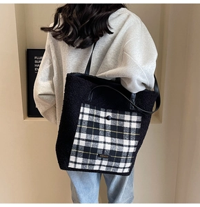 Detail of fuzzy black tote bag with houndstooth pocket and premium leather handles