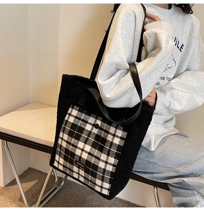 Close-up of fluffy black faux fur tote bag with a stylish black and white checkered pocket