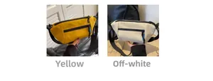 Detailansicht der gelben und beigen Canvas-Halbmondtaschen mit verstellbaren Riemen
