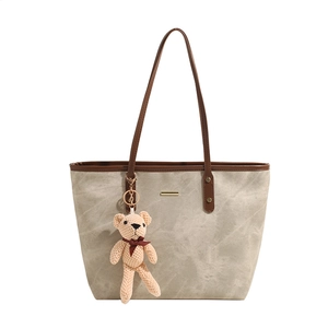 Minimalist large-capacity tote bag in matte khaki with brown straps and cute bear charm