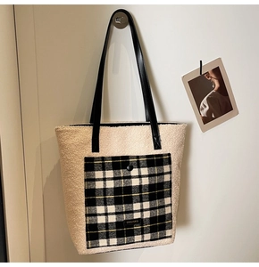 Detail of fuzzy tote bag showing sheepskin texture and checkered front pocket