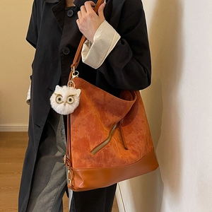 Vintage corduroy tote bag with owl pendant shown on model for casual commuting