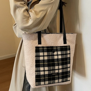 Winter faux fur tote bag in beige with black and white plaid pocket and leather straps