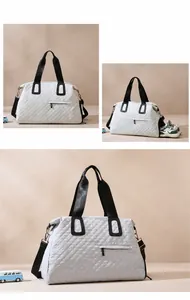 Quilted travel bag with independent shoe compartment and detachable black shoulder strap
