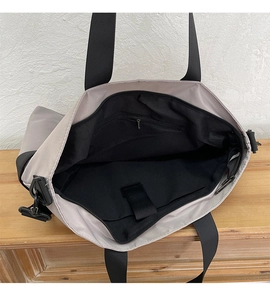 Interior view of large tote bag with laptop compartment and secure zipper pocket