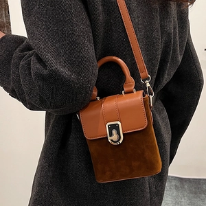 Retro brown suede crossbody bag for women styled with a grey herringbone coat