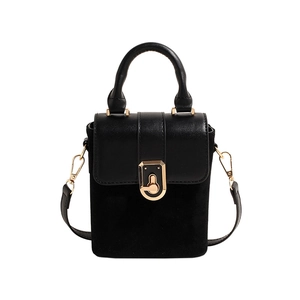 Elegant black leather square handbag with suede sides and golden clasp on white background