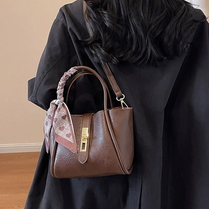 Vintage dark brown bucket bag with gold clasp and heart scarf shown on model