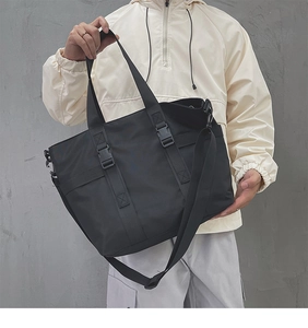 Macro detail of high-density nylon tote bag showing adjustable wide strap and buckle