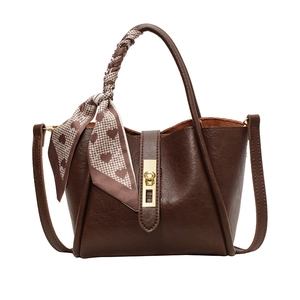 Vintage brown leather bucket handbag with houndstooth scarf and golden twist lock