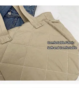 Detailed close-up of light khaki quilted nylon tote bag with soft diamond lattice texture