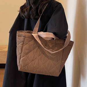 Quilted brown nylon tote bag with large capacity and soft padding for casual daily commute