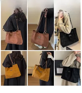Detail view of large quilted suede tote bags in multiple colors for daily commuting