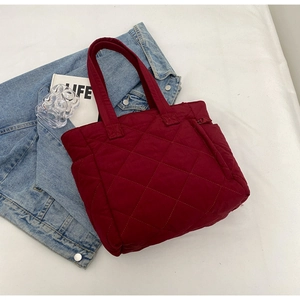 Burgundy quilted nylon tote bag with rhombus stitching and large capacity detail