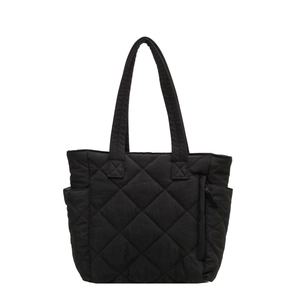 Large black quilted nylon tote bag with shoulder straps and side pockets for commute