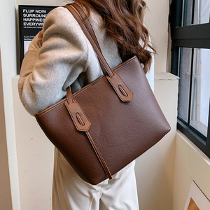 Brown lychee leather tote bag for women showing a spacious design for daily commuting