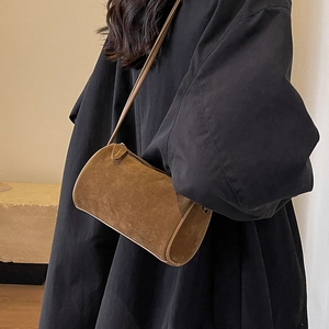 Brown matte suede Boston cylinder crossbody bag with minimalist shoulder strap for women