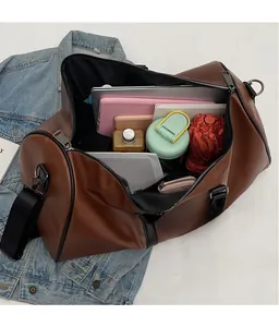 Spacious interior of brown travel bag showing laptop, umbrella, and daily essentials